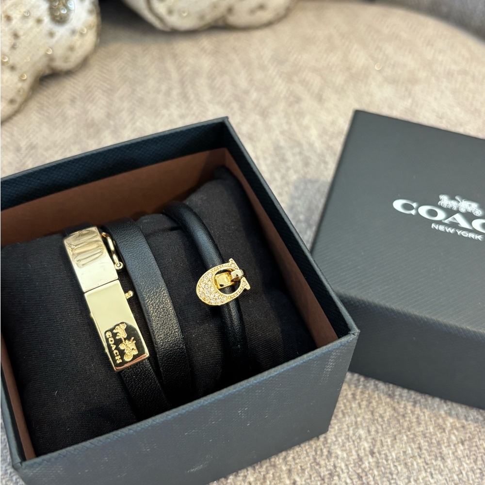 Two COACH Black Leather Bracelets with Gold Accents